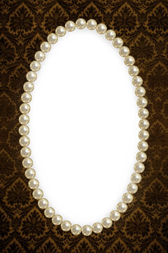 Oval frame of pearls on a background of brown pattern close-up