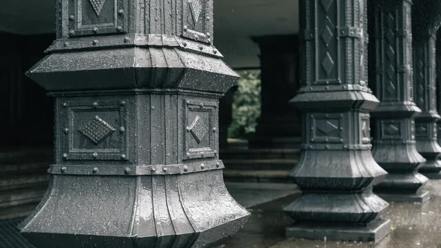 Close medium shot capturing paneled metal cladding on building supports emphasizing geometric design elements and robust ornamental protection for structural stability