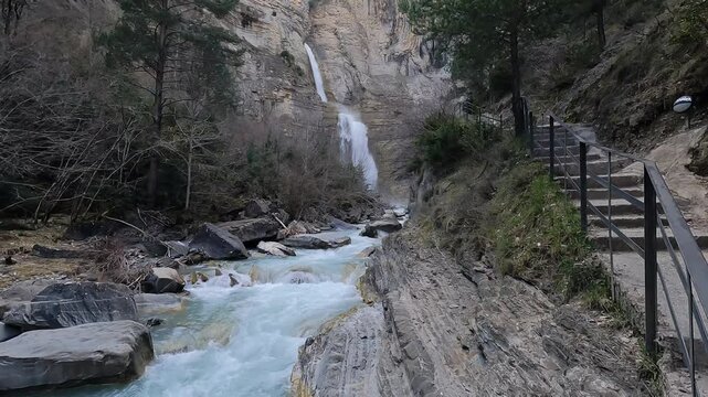 Sorrosal Waterfall, a stunning 60-meter waterfall located in the town of Broto, in the province of Huesca, in the Aragonese Pyrenees.	