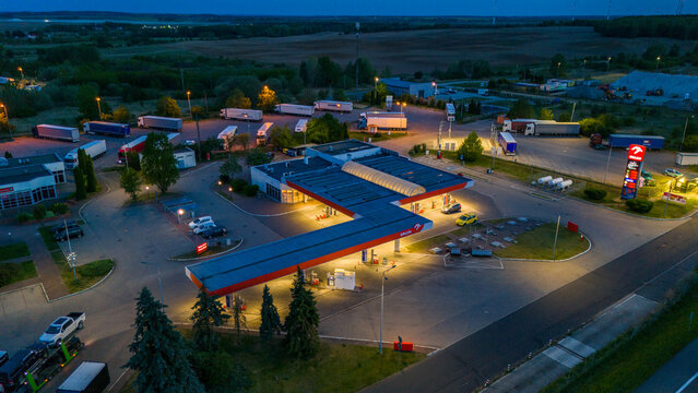 Kolbaskowo, Poland - May 3, 2026: Aerial view of Orlen gas station at night.