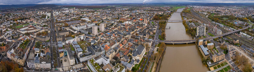 Fototapeta premium An panoramic aerial view of the old town city Thionville in France on a cloudy noon in autumn.. 