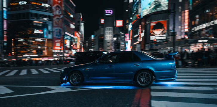 Tokyo, Japan: car in Shibuya intersection with neons