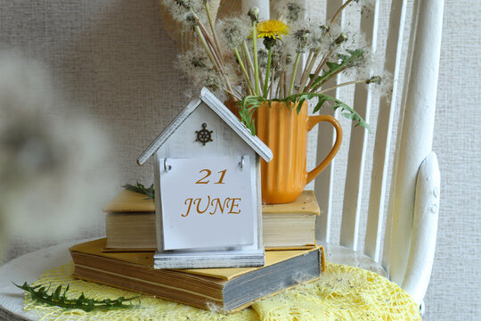 June 21st Calendar: A decorative calendar with the number 21 and the month of June in English against a background of a bouquet of dandelions