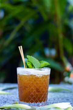 grapefruit cocktail of fernet with mint leaves on a summer afternoon