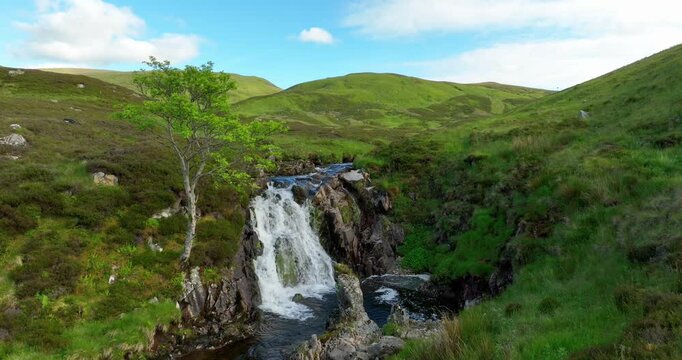 Scottish waterfall in highlands near monroe on hiking trail still