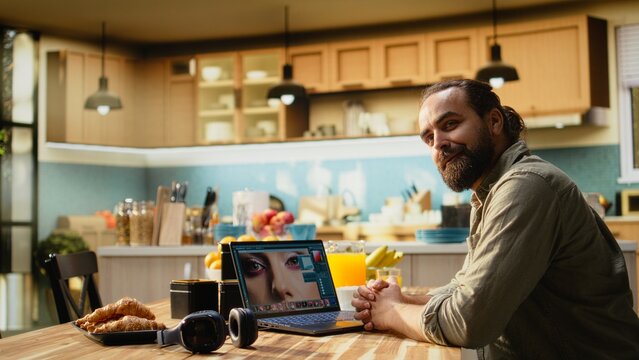 Professional photographer working remotely editing photos on laptop, content creation, Photo editing software with raw images and color grading adjustments highlighting creative post production.