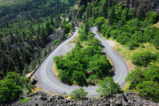 Horseshoe bend in Historic Columbia River Highway in Oregon in springtime with green trees