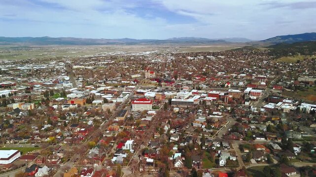 Left panning aerial view over Helena Montana downtown and valley plains