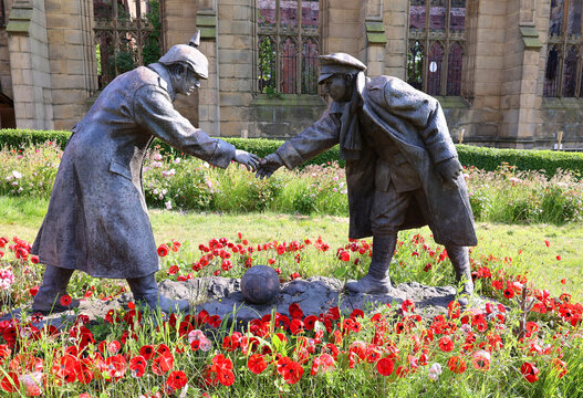 LIVERPOOL UNITED KINGDOM: A sculpture commemorating the &ldquo;All together now&rdquo; statue by Andy Edwards, commemorating the Christmas Day 1914 truce, stands in grounds of St Luke's Church in Live