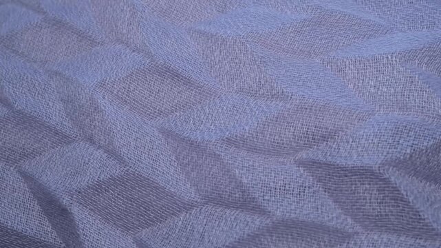 Close-up of zigzag patterned fabric rotating
