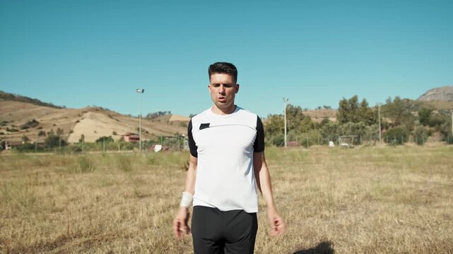 Soccer Player Doing Jumping Jacks To Warm Up
