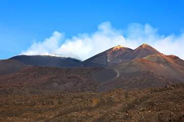 The Etna volcano crater. Black Volcanic Earth, Volcanic Lava and Stones. Smoke on Mount Etna The island of Sicily, Italy. © Daniel Meunier