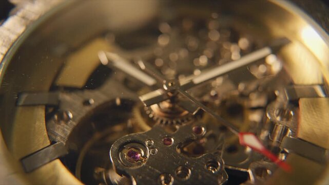Close view of a mechanical watch displaying gears and jewels during daylight hours in a focused setting
