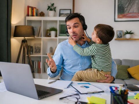 Child interrupting remote work video call at home