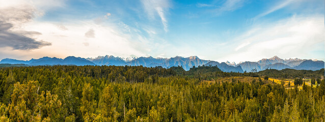Panoramic views of the Southern Alps and rain forest from the tree walk suspension bridge at Hokitika NZ © Stewart