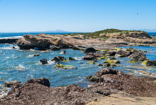 Dramatic coastal landscape of Tabarca Island marine reserve under a blue sky
