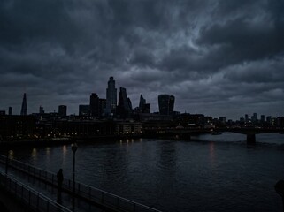 Fototapeta premium Dark megacity skyline during nighttime power outage