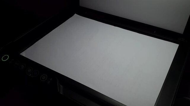 Hand on scanner glass, white paper sheet, office document scanning, copy machine, office workflow, document digitizing