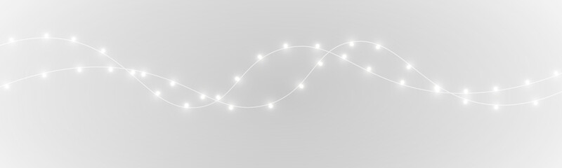 Christmas string lights PNG with warm glow, elegant golden ribbon overlay, perfect for holiday backgrounds, greeting cards, and festive designs. © kleinstock