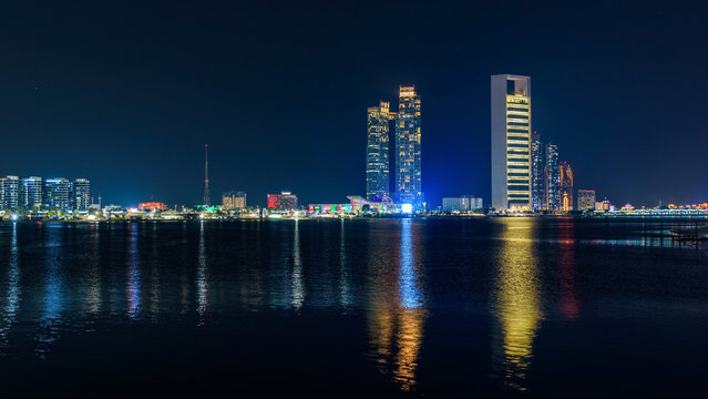 ADNOC headquarters and Abu Dhabi Corniche skyline at night