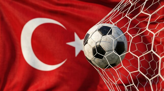 Soccer ball hitting the back of the net for a goal with the national flag of Turkey waving in the background, symbolizing sports success and national pride