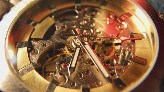 Time lapse video. Close view of a mechanical watch showing inner workings and details of gears and hands during daylight