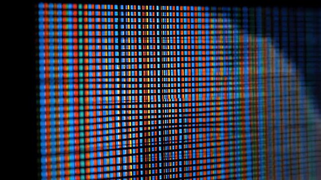 Macro Extreme Close-Up of Digital LED Screen with Visible RGB Pixels Grid Pattern Abstract Background