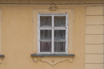 Fototapeta premium Ancient medieval stone window in an old European castle wall