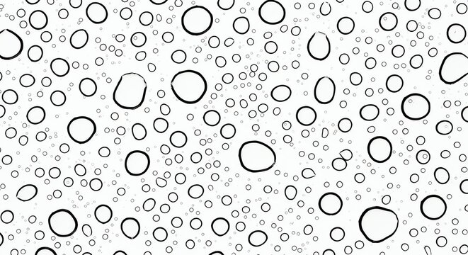 Black water drops pattern on a light surface