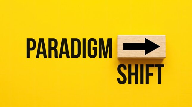 Paradigm shift text written on a bright yellow background with a wooden block featuring a black arrow pointing rightward