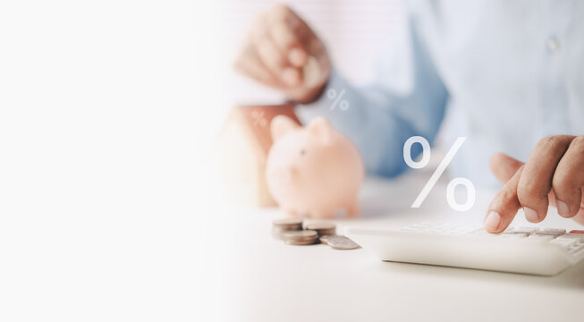 Home Loan Planning and Mortgage Calculation Concept with Calculator, Piggy Bank, Interest Rate Symbol and Financial Savings Strategy for Property Purchase, Home Ownership and Housing Finance Decisions