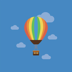 Obraz premium Colorful hot air balloon floats gently above blue sky. Soft clouds drift in background. Simple design appeals to all ages. Ideal for travel, adventure, or summer themes