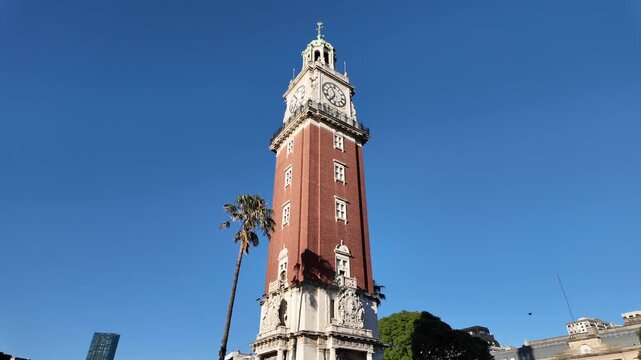 Monumental Tower revealing the Retiro railway terminal under a clear blue sky at sunrise in Buenos Aires Argentina.