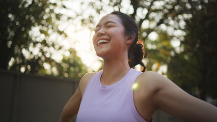 Asia young Gen Z people mindful happy woman open arm relax body deep stress relief outdoor nature green public park sun light self love anti aging life asian female mental health care modern medical. © ChayTee