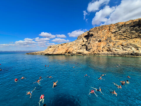 The Blue Lagoon on Cyprus Island tropical sea beach Cavo Greco in the morning. Natural stone rock love bridge