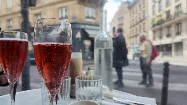 Red Sparkling Wine on a Parisian Cafe Terrace Table