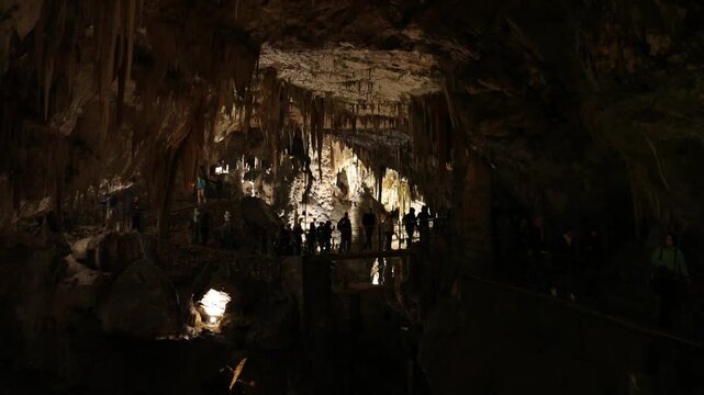 view from inside postojna cave (postojnska jama) famous deep cave system in slovenia europe with train inside rail ride km walk walking interior rock formations stalactite stalagmite ancient geology 