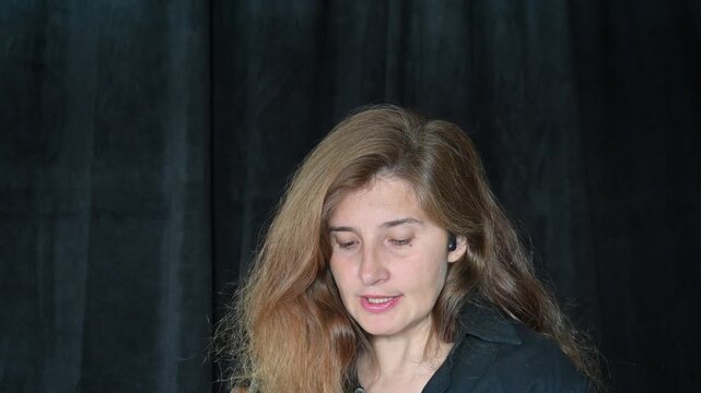 Portrait of a woman on a black background,