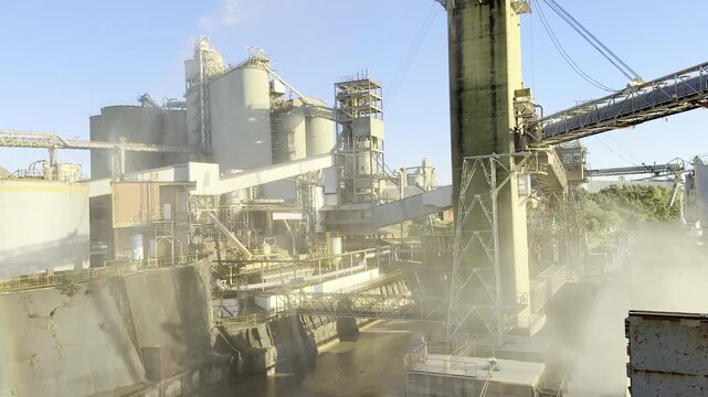 grain dust from ship during loading wheat in bulk and industrial waterfall for protect the berth.