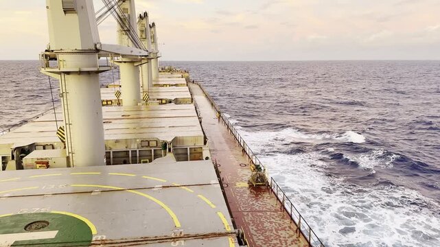 ship rolling pitching at morning in motion at ocean.