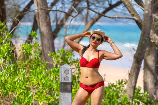 Woman with red bikini blur background