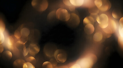 Fototapeta premium Golden shimmer abstract grainy background with soft blurred light leaks and elegant cinematic texture