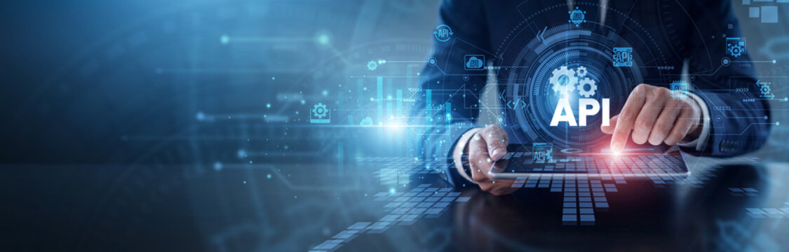 API integration process. Developer using tablet to sync software applications and streamline data exchange across global networks. Efficient system connectivity and backend interface tools.