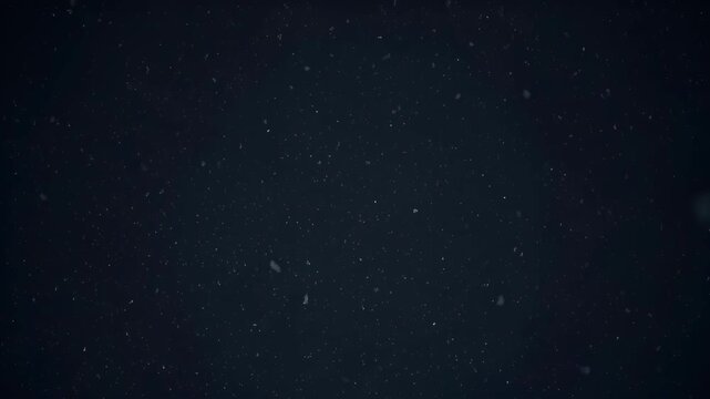 Dark night sky with drifting dust particles, soft star field and abstract space background with copy space
