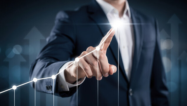 Businessman touching upward trending graph on digital interface showing business growth and success