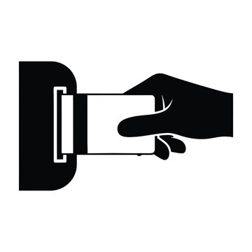 Hand inserting card into slot machine