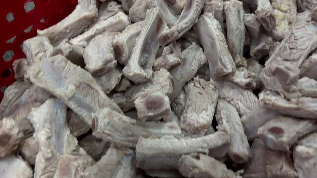 Blanched pork ribs prepared before entering the cooking process for Bak Kut Teh production. Raw material preparation procedure supporting food quality, broth clarity,
