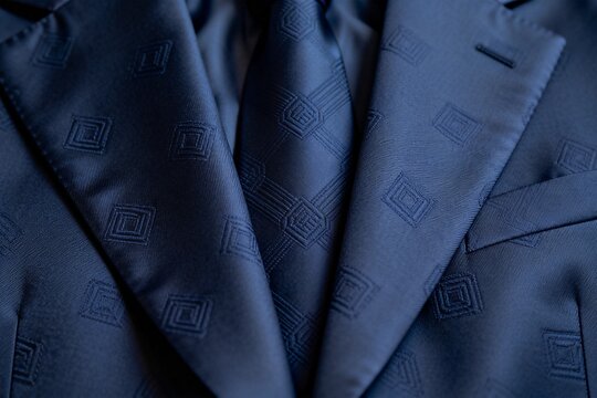Closeup of a blue suit jacket and tie