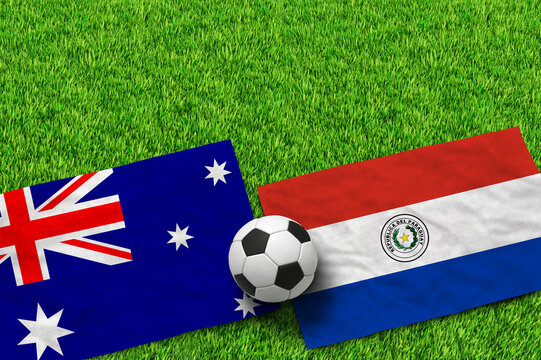 Australian and Paraguayan flags with a soccer ball on green grass field