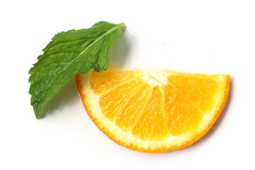 Fresh orange slice paired with a green mint leaf © Bowonpat